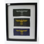 German framed collection of cloth breast eagles.