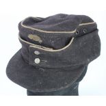 German M43 Forage cap in black with white piping and Totenkopf skull, likely Panzer related, service