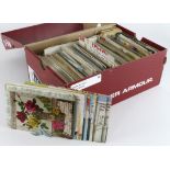 Red shoebox packed with various old postcards (100's)