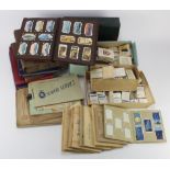Large box of cigarette cards mostly loose and in old slot albums, plus a modern album of Phone cards