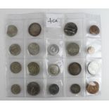 GB & World (19) 19th-20thC assortment in an album page, including silver up to crown-size, mixed