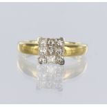 18ct yellow gold ring consisting of nine princess cut diamonds held together as a square cluster