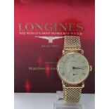 Gents 18ct cased Longines wristwatch. The signed cream dial roman numerals / baton markers,