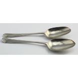 Two silver tablespoons comprising a Queen Anne hanoverian rat-tail Britannia Standard one for London