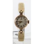 Ladies 9ct cased Omega manual wind wristwatch on a gold plated strap. Watch working when catalogued