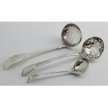 Two George III silver sugar sifters c1780/1790 plus one Victorian silver fiddle pattern sugar