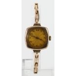 Ladies 9ct cased manual wind wristwatch on a 9ct expandable strap, working when catalogued
