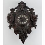 Black forest carved clock, with hounds head, fish & bird decoration, pendulum present, length