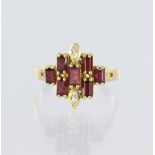 18ct yellow gold ring set with seven rectangular step cut rubies, measuring approx. 3.5mm x 2.5mm,
