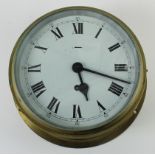 Ships brass bulkhead clock, Roman numerals to dial, stamped with military arrow to reverse 'Made