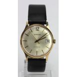 Gents 9ct cased automatic wristwatch by Garrard. Presentationally engraved on the back. Working when