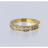 18ct yellow gold half eternity ring set with ten round brilliant cut diamonds in a channel