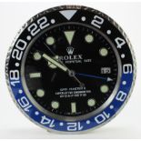 Advertising Wall Clock. Black & blue (Batman) 'Rolex' style advertising wall clock, black dial reads