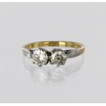 18ct yellow and white gold ring set with two round brilliant cut diamonds weighing approx. 0.40ct