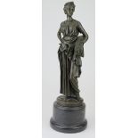Bronze figure of a woman hold a sheaf of wheat. On a marble base. Signed Zegut/Tusey. Height