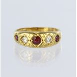 18ct yellow gold flared band ring set with five graduated rubies and diamonds, central round ruby