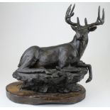 Bronze study of a stag. On a wooden base. Measures approx 35.5cm. Signed and with a stamped seal (