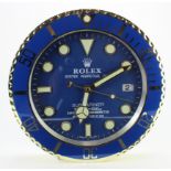 Advertising Wall Clock. Blue/gold 'Rolex' advertising wall clock, blue dial reads 'Rolex Oyster