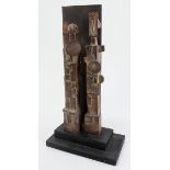 John Maltby (1936-2020). A stoneware sculpture, untitled, depicting two figures with a wooden wall