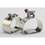 Two unusual silver Napkin Rings, one with a dog on the top and one with a fox on the top (Both are