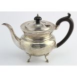 Silver teapot raised on four feet, with ebony handle and finial, hallmarked 'H.J&G, Birmingham