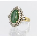 18ct yellow gold dress ring set with an elongated oval jadeite measuring approx. 14mm x 9mm,