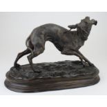 Bronze study of a greyhound holding a stick. Signed 'Mene'. Height measures approx 22cm.