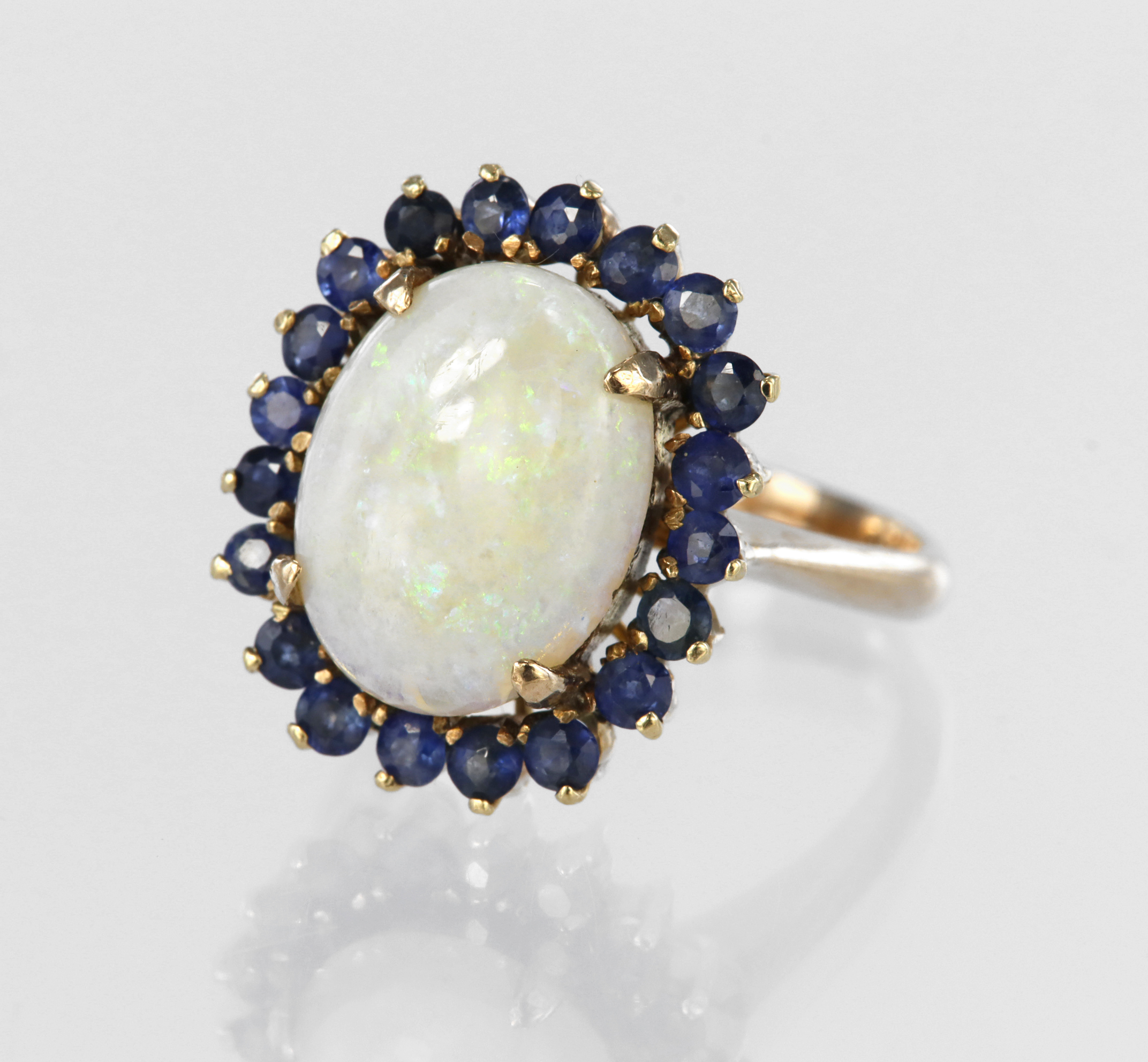 14ct yellow gold dress ring set with a central oval opal cabochon measuring approx. 13mm x 10mm in a