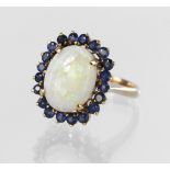 14ct yellow gold dress ring set with a central oval opal cabochon measuring approx. 13mm x 10mm in a