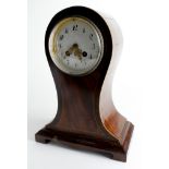 Mahogany mantel clock with inlaid decoration, white enamel dial with Roman numerals, pendulum