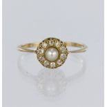 9ct yellow gold cluster ring set with a central pearl measuring approx. 4.5mm diameter, surrounded