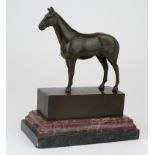 Bronze study of a horse, bearing the mark 'Andre'. On a red marble base. Height measures approx