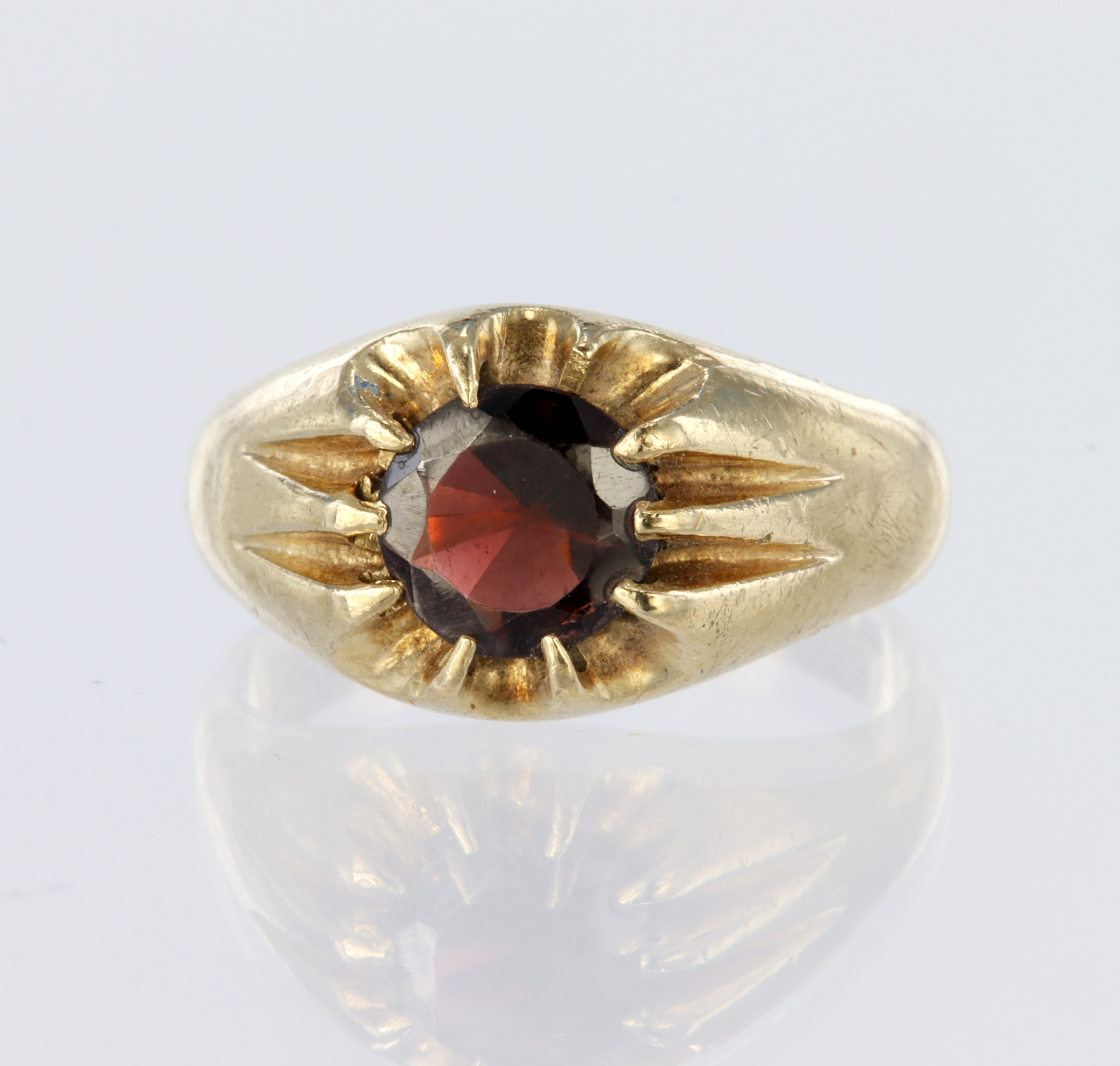 9ct yellow gold signet style ring set with a single round garnet measuring approx. 7mm in a gypsy