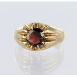 9ct yellow gold signet style ring set with a single round garnet measuring approx. 7mm in a gypsy