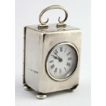Silver cased miniature carriage clock, on four ball feet (one damaged), hallmarked 'HM, Chester