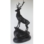 Large bronze study of a stag standing upon a rock. On a marble base. Signed J Moigni. Height
