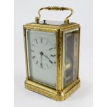 Gilt brass repeating carriage clock, with ornate fretwork, movement stamped 'Japy Freres & Cie,