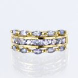 9ct yellow gold three row dress ring set with a central row of nine round tanzanites measuring