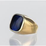 18ct yellow gold signet ring set with a rectangular reverse faceted blue stone with a shallow