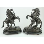 After Guillaume Cousteau. A pair of bronze Marley horses, each signed, mounted on wood bases,