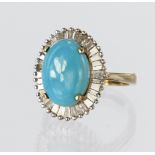 9ct yellow gold cluster ring set with a central oval blue stone cabochon measuring approx. 14mm x