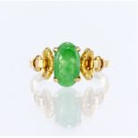 14ct yellow gold ring set with an elongated oval jadeite measuring approx. 10mm x 6mm, with