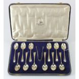 Silver twelve teaspoon and sugar tong set, hallmarked 'W&H, Sheffield 1944', each spoon with dab