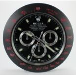 Advertising Wall Clock. Matt black 'Rolex' style advertising wall clock, black dial reads 'Rolex