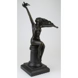 Bronze figure of a female nude holding a dove in her right hand. On a marble base. Signed A