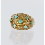9ct yellow gold domed flared head ring set with seven round turquoise cabochons in claw settings,