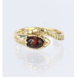 9ct yellow gold snake ring set with an oval garnet cabochon measuring approx. 6mm x 5mm, finger size