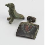 Antiquity. A small ancient bronze bird, height 30mm approx., together with a mediaval square