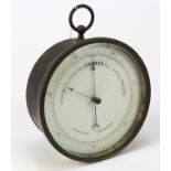 Barometer. Gilt brass holosteric barometer, diameter 12.5cm approx., on a wooden stand (working when