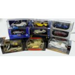 Diecast Models. A collection of twelve boxed mostly 1:18 scale model cars, makers include Norev,